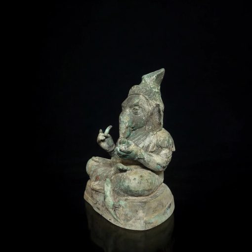a statue of a person smoking a pipe