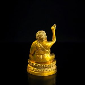 a gold statue of a man