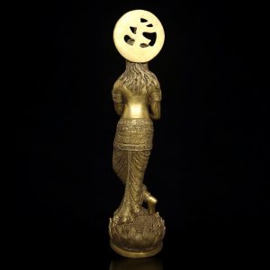 a gold statue of a woman