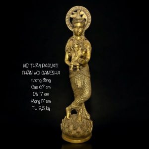 a gold statue of a woman holding a baby