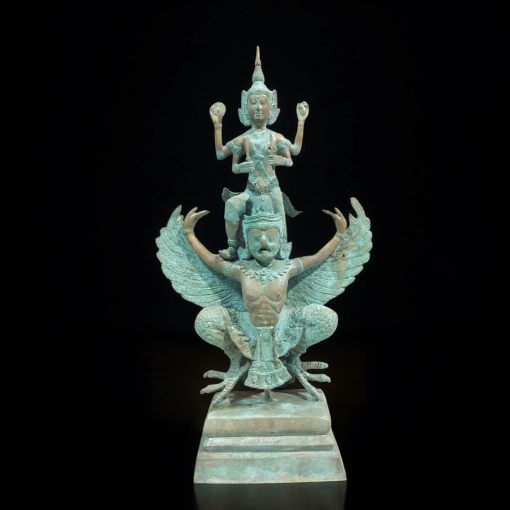 a statue of a person on a bird