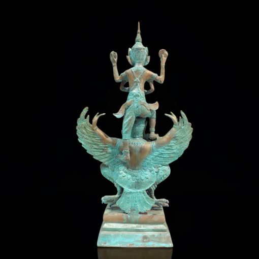 a statue of two people on a black background