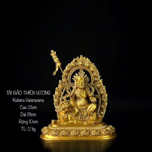 a gold statue of a man sitting on a lion