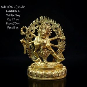 a gold statue of a person with arms raised