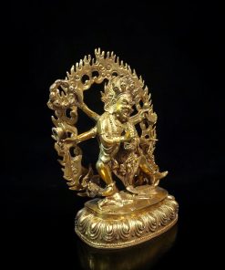 a gold statue of a person holding a sword