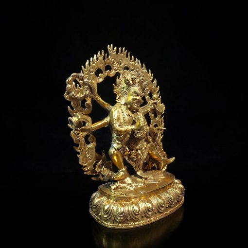 a gold statue of a person holding a sword
