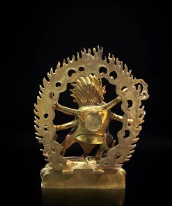 a gold statue of a person holding a tree