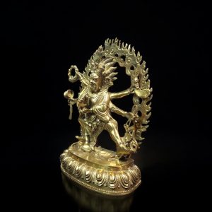 a gold statue of a man holding a large circle