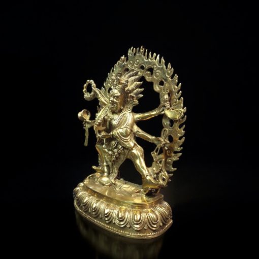 a gold statue of a person holding a sword