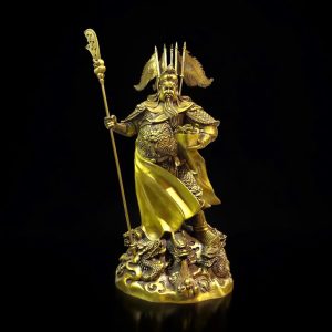 a statue of a person holding a spear