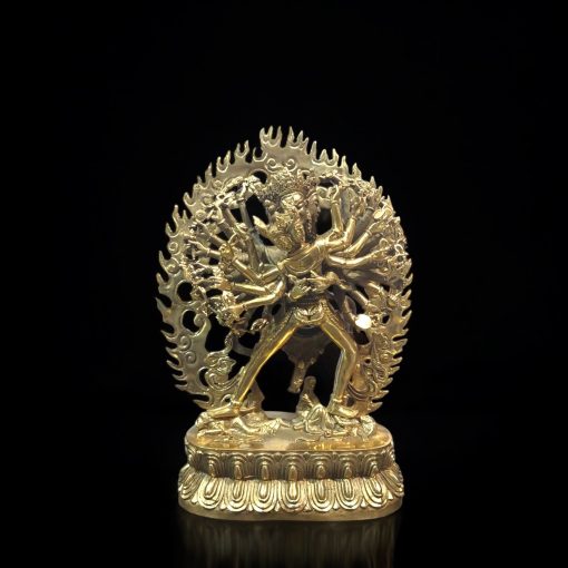 a gold statue of a man with arms and legs