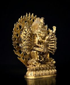 a gold statue of a person with many arms
