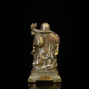 a statue of a man holding a bag