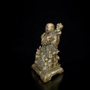 a statue of a man holding a flower