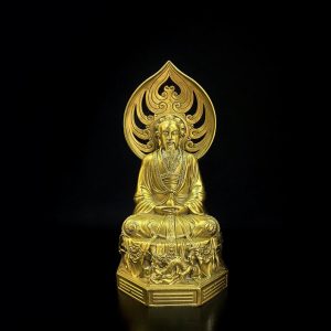 a gold statue of a man