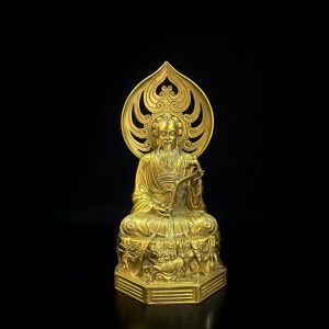 a gold statue of a man