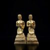 a pair of gold statues